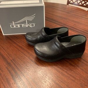 Dansko Black Floral Embossed Clogs